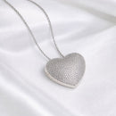 RELICÁRIO CORAÇÃO CRAVEJADO RÓDIO BRANCO